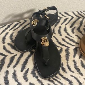 Michael Kors black sandal with gold key/lock embellishment